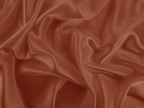 istock Beautiful elegant wavy brown satin silk luxury cloth fabric texture. 1256637042