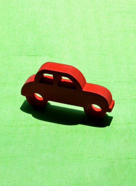 istock red toy car on the green grass 1256637504