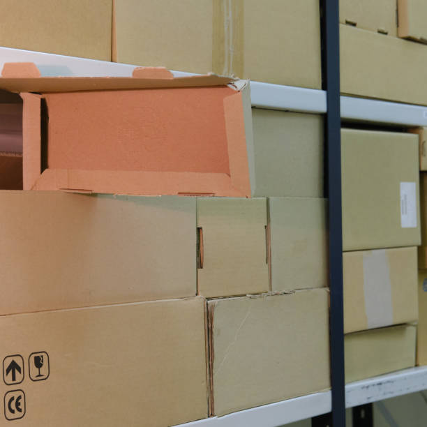 istock Warehouse with opened boxes. Thief at the mail warehouse 1256638936