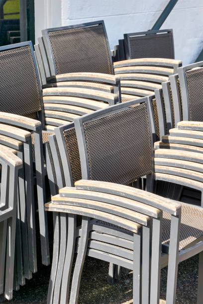 istock Stacked chairs on a terrace of a closed restaurant. 1256643568