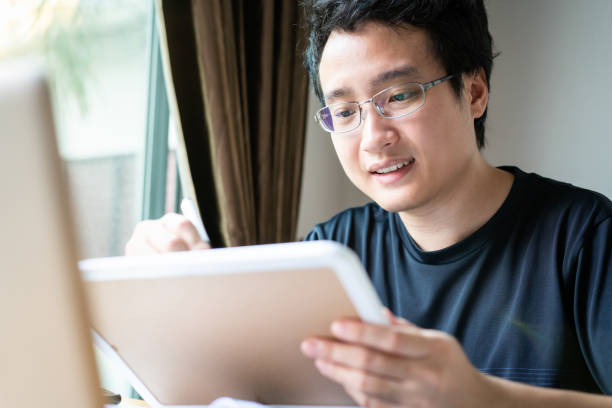 istock Cheerful Asian young man portrait 1256646220