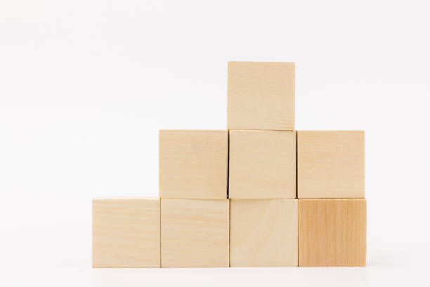 istock Wood block stacking as step stair on white. Business concept for growth success process. Copy space 1256647584
