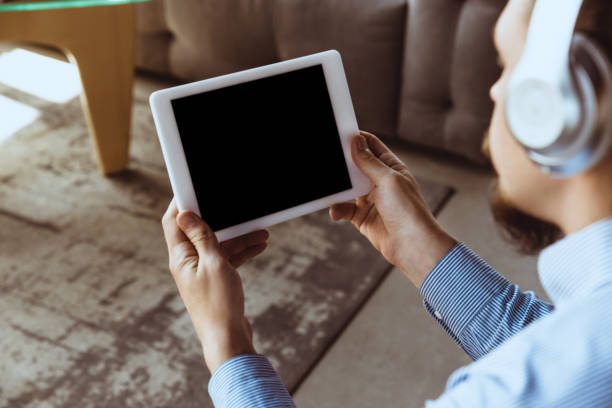 istock Man working from home during coronavirus or COVID-19 quarantine, remote office concept. 1256649629