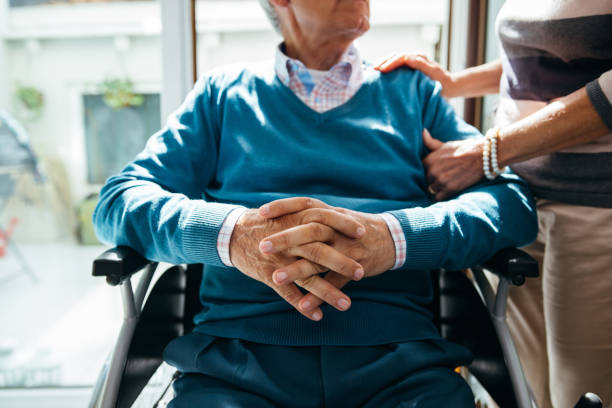 istock Senior man in wheelchair 1256650635