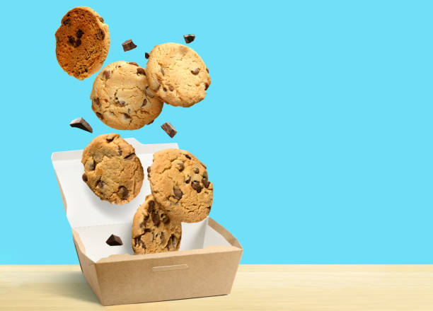 Stack of chocolate chip cookies tied with a string isolated on white background. Crunchy and tasty sweet food or dessert