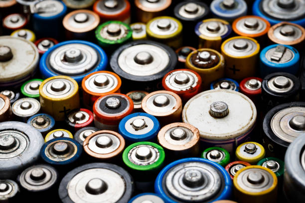 istock Used batteries toxic waste recycling and ecology issues concept background 1256650748