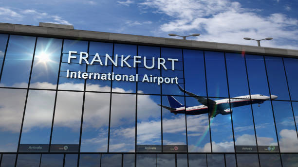 istock Airplane landing at Frankfurt mirrored in terminal 1256652776