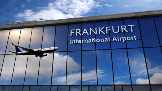 istock Airplane landing at Frankfurt mirrored in terminal 1256652841