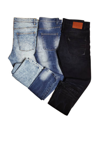 istock Blue Jeans Pants on white fabric background 1256653420