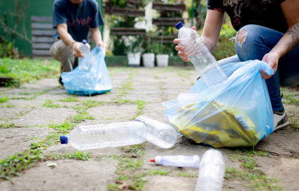 istock People recycling plastic and bottles 1256656668
