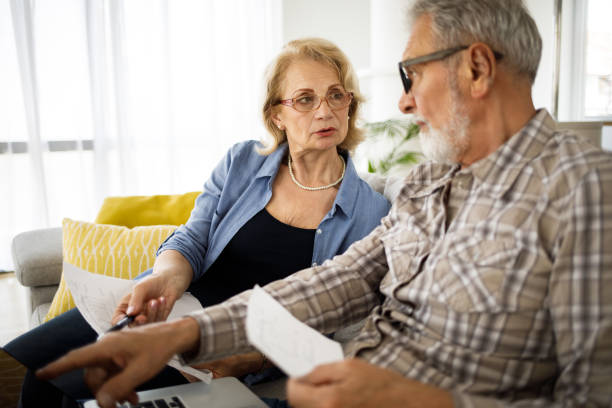 istock Senior couple having problems with home finances 1256657359