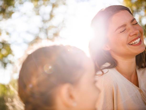 istock Cheerful single mother with her small daughter in nature. 1256663176