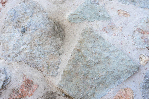 istock Stone texture of old ancient wall in sunny day. Modern luxury background for design with space for text 1256663231