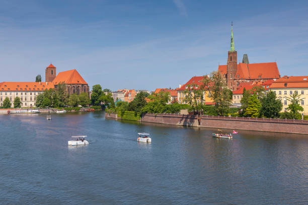 istock Tourist boats on Oder River, city attraction. Popular view on medieval St. John the Baptist Cathedral 1256664513