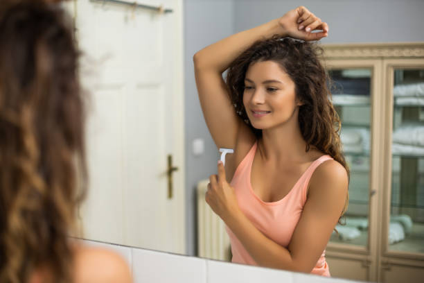istock Woman shaving under her arm 1256669214
