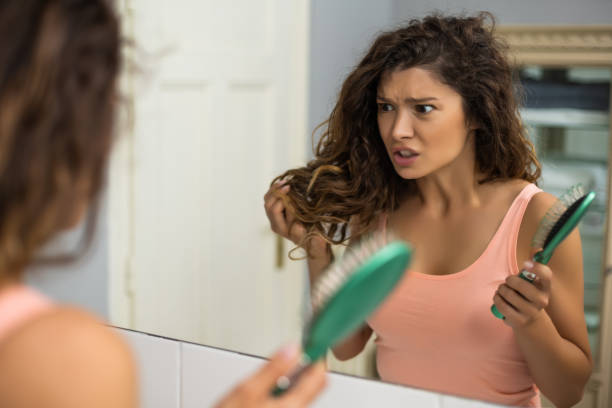 istock Angry woman brushing hair 1256669288