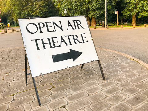 Sign showing the way to the open air theatre set up for the summer months,