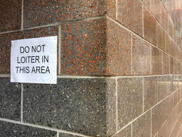 istock Printed sign instructing people not to loiter around a building 1256669383