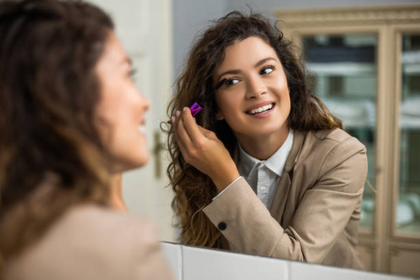 istock Woman applying mascara 1256672092