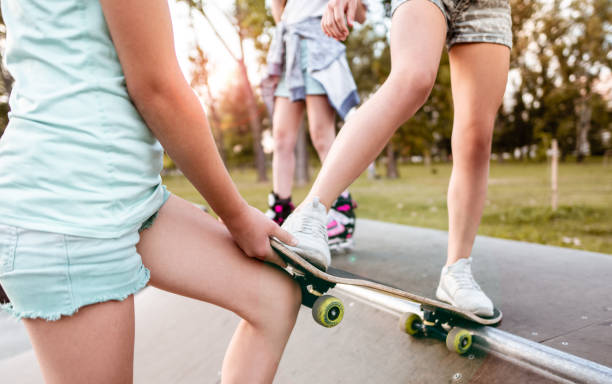 istock Young teenagers with a Skateboard 1256673840