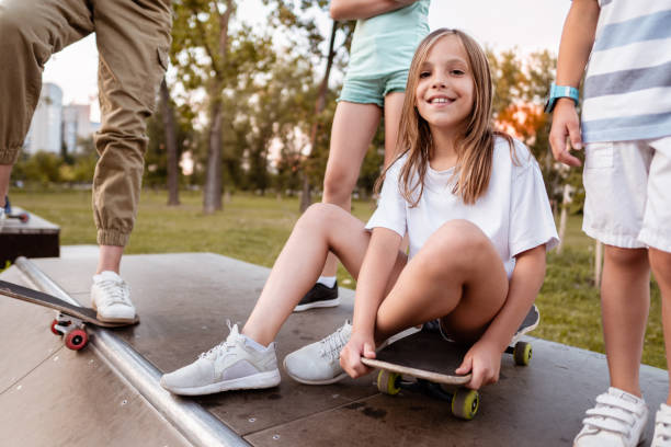 istock Young teenagers with a Skateboard 1256673895