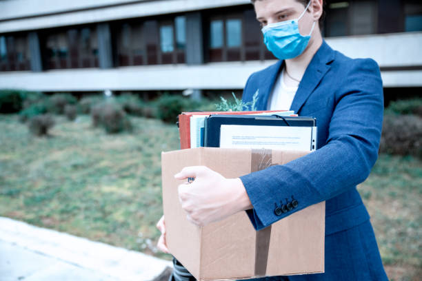istock Young Businessman walking from the job got fired 1256675052