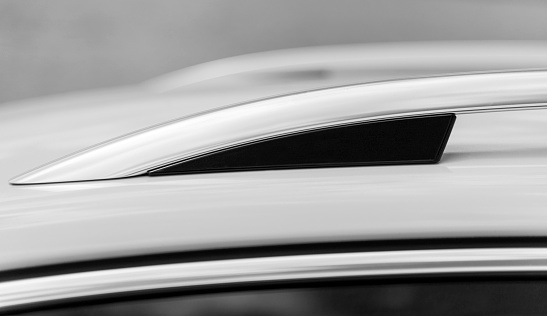 Long chrome detail on the top of the car. Black and White.