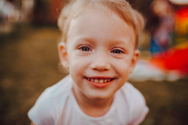 istock The baby laughs and looks at the camera 1256677085