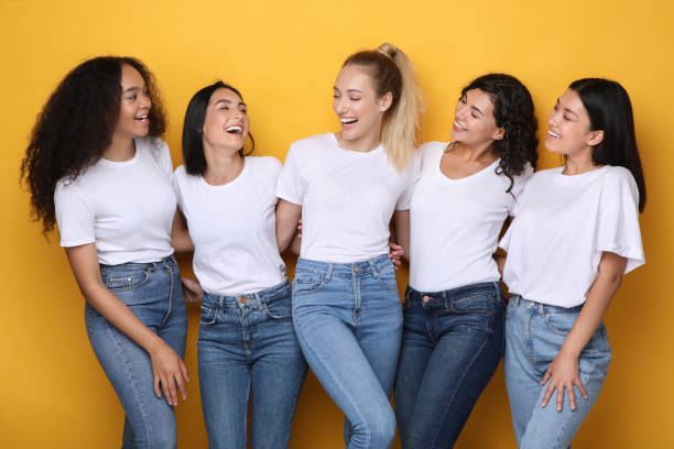 istock Five Mixed Girls Laughing Posing On Yellow Background In Studio 1256677127