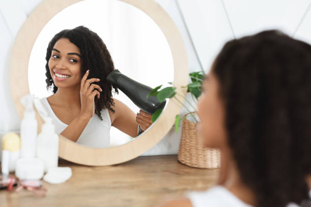 Black Woman Blow Dry Stock Photos, Pictures & Royalty-Free Images - iStock