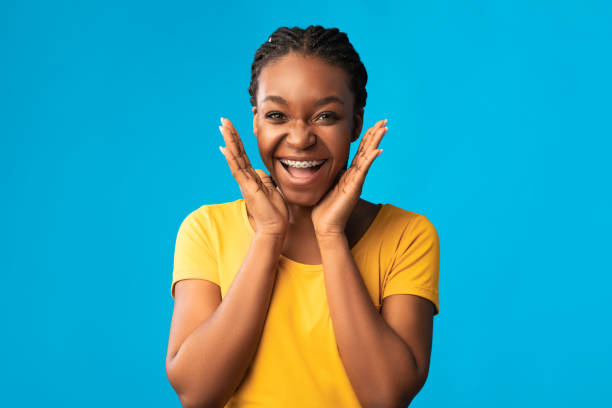 istock Excited Girl With Brackets Smiling To Camera Posing In Studio 1256678544