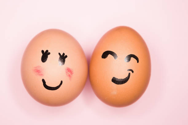 istock It's love! Boy egg expressing romantic interest in girl egg 1256679218