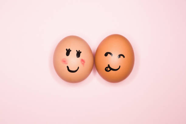 istock It's love! Boy egg expressing romantic interest in girl egg 1256679519