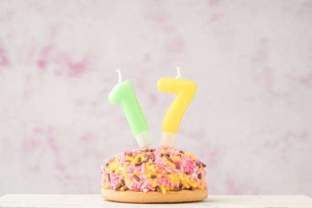 istock cupcake with number seventeen shaped candle for birthday 1256679841