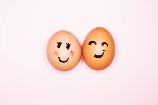 istock It's love! Boy egg expressing romantic interest in girl egg 1256681274