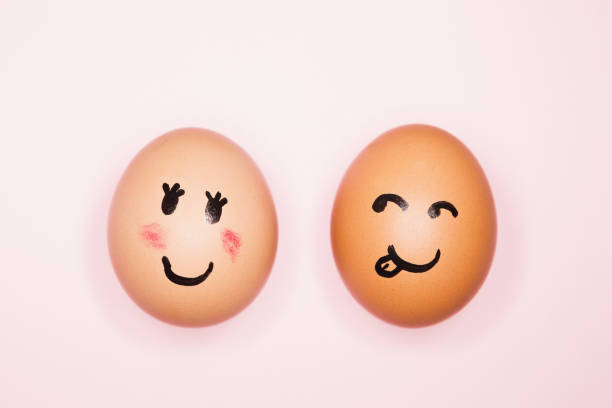 istock It's love! Boy egg expressing romantic interest in girl egg 1256681748