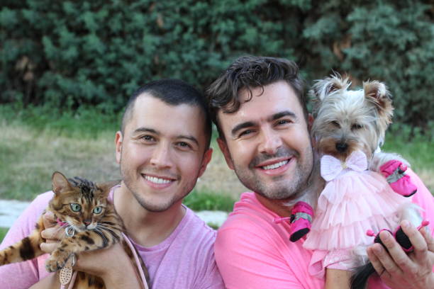 istock Gay couple with two pets 1256684924
