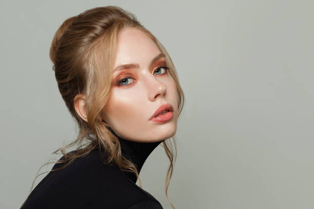 istock Pretty woman in black turtleneck sweater 1256685562