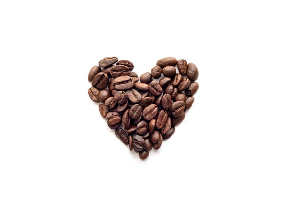 istock Heart shape of roasted coffee beans isolated on white. 1256686398