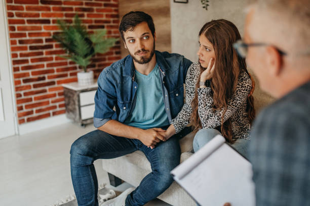 istock Young couple on a therapy session with a psychologist 1256694529