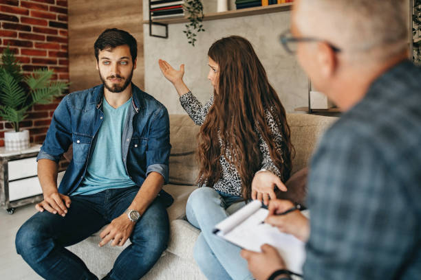 istock Young couple on a therapy session with a psychologist 1256694669