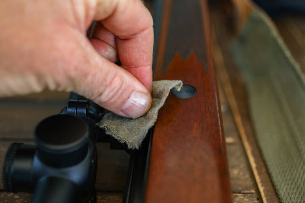 A close up of a hunting rifle being cleaned. stock photo