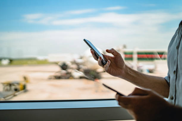 istock Man on airport waiting for a flight 1256696451