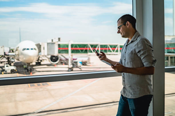 istock Man on airport waiting for a flight 1256697316