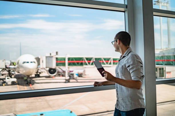 istock Man on airport waiting for a flight 1256697409