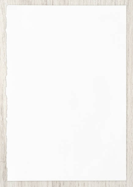 istock White paper sheet on wood for background. 1256697980