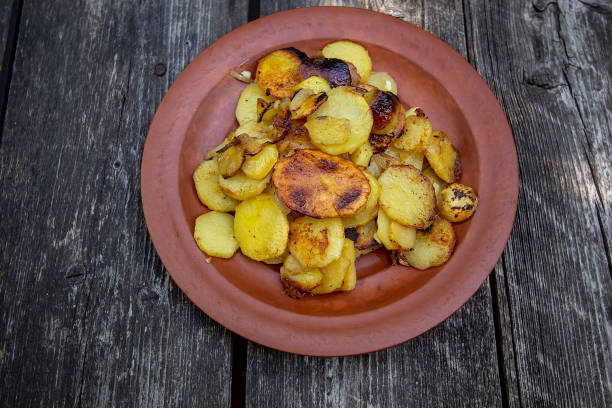 istock fried potatoes with onions and garlic. popular Russian dish 1256698420