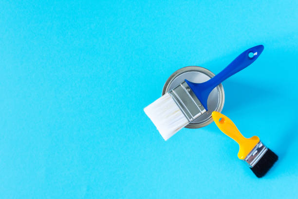 istock Can of white paint with brushes 1256699536