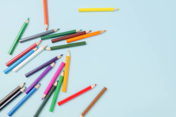 istock Colorful colored pencils on a blue background 1256701014
