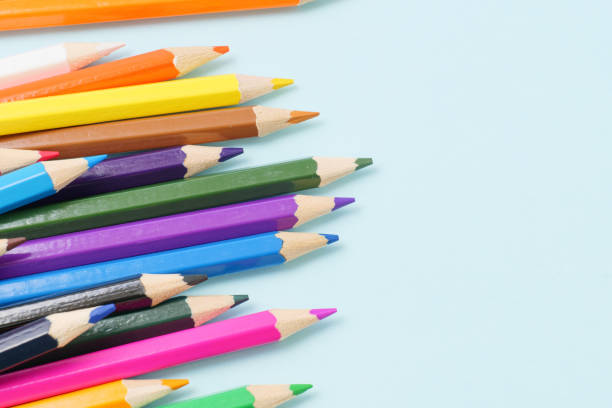 istock Colorful colored pencils on a blue background 1256701031